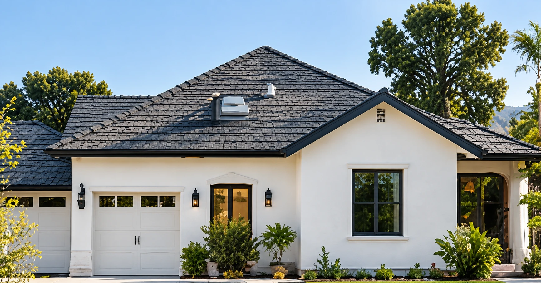 Light-colored home with a dark shingle roof