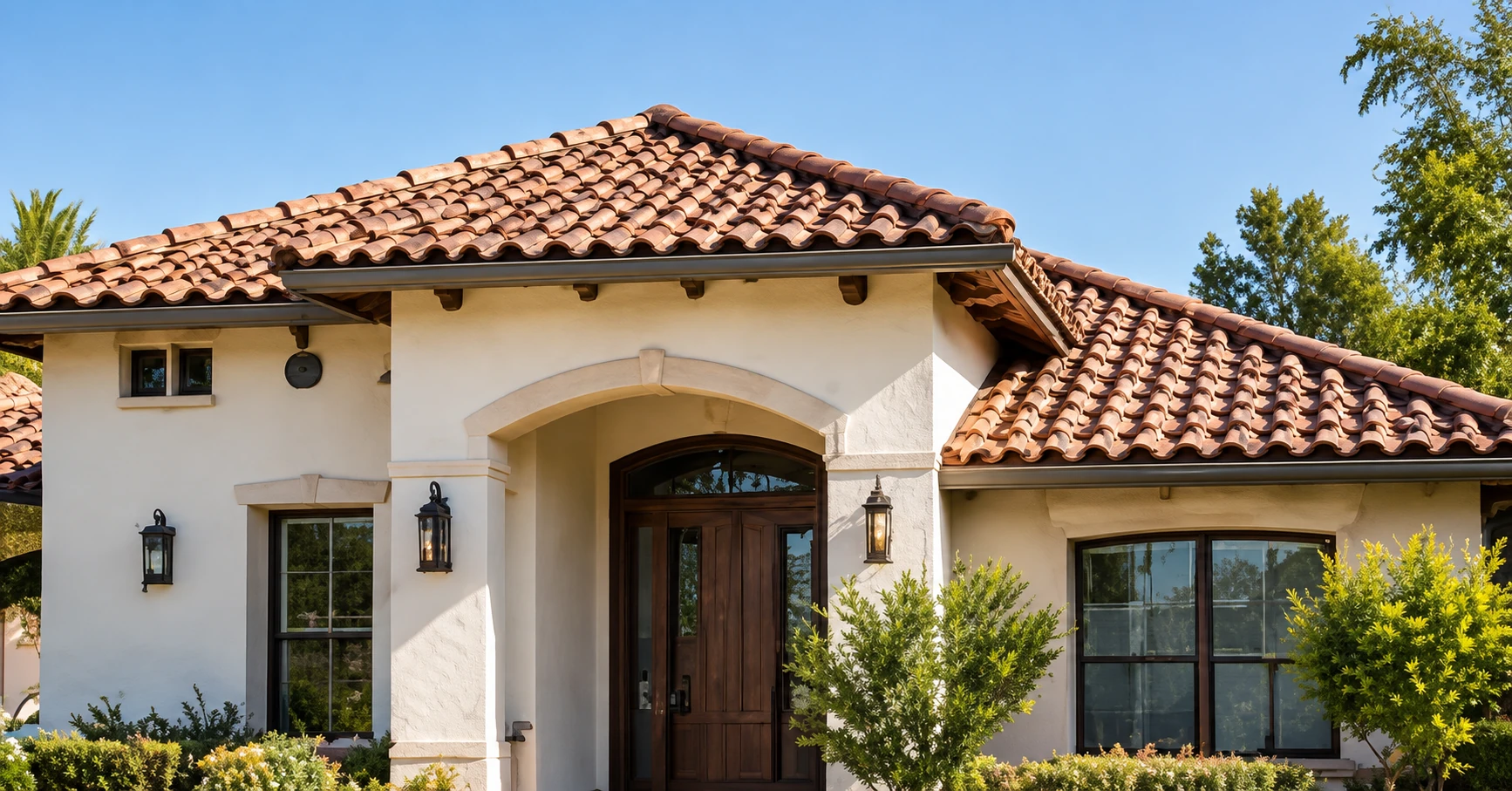 Spanish-style home with a terracotta tile roof